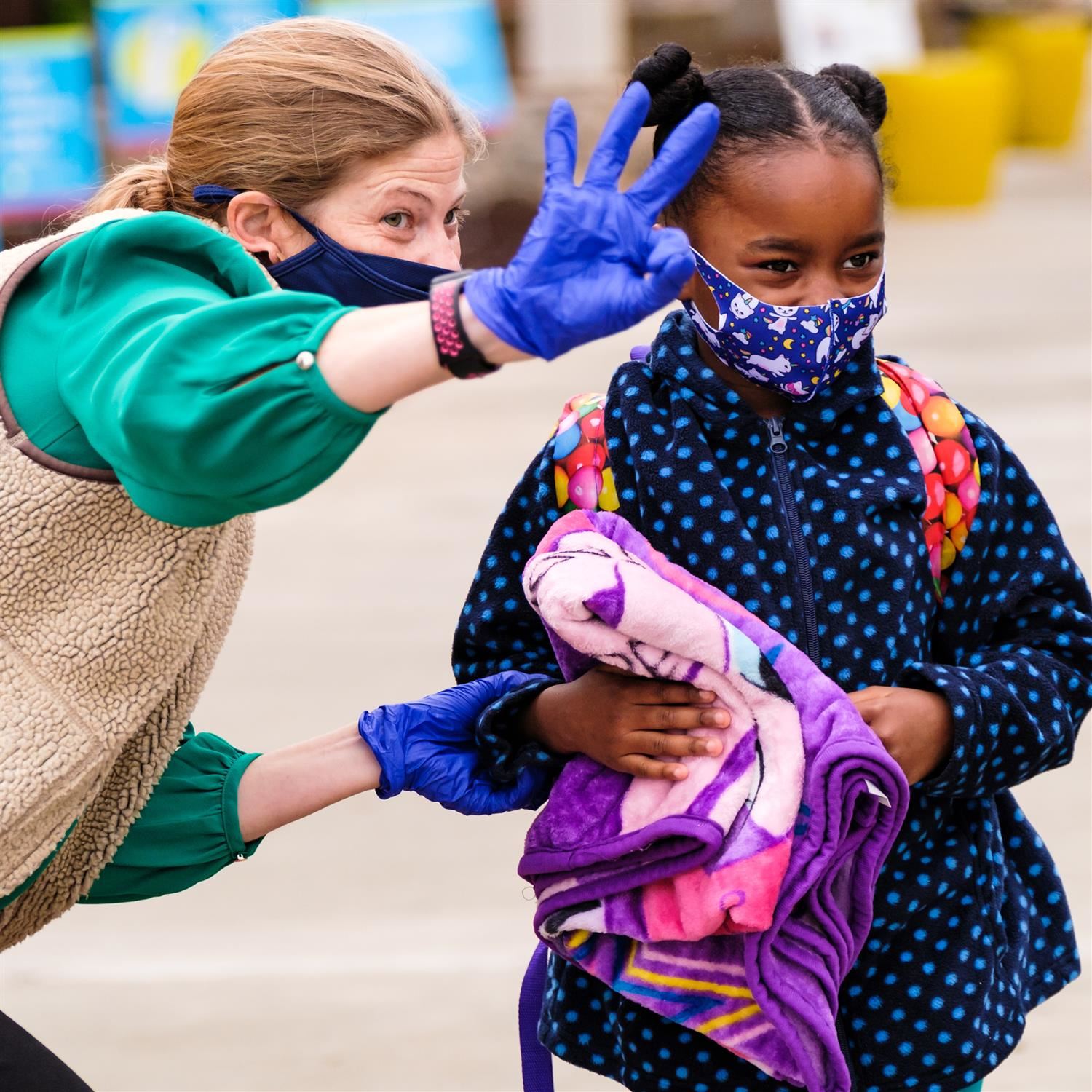  Principal Leslie Taylor directs a Wiley student into the school building